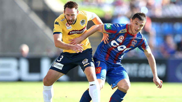 Mariners defender Josh Rose challenges for the ball with Jets winger Enver Alivodic.